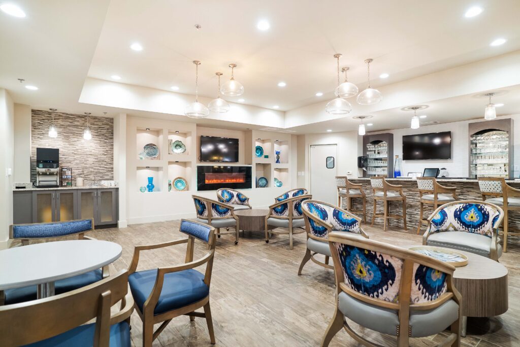 CelebrationVillageLg-32 - Celebration Village Forsyth A beverage station, bar area, and intimate seating furnish the lounge at Celebration Village Forsyth, a senior living community near Alpharetta, GA.